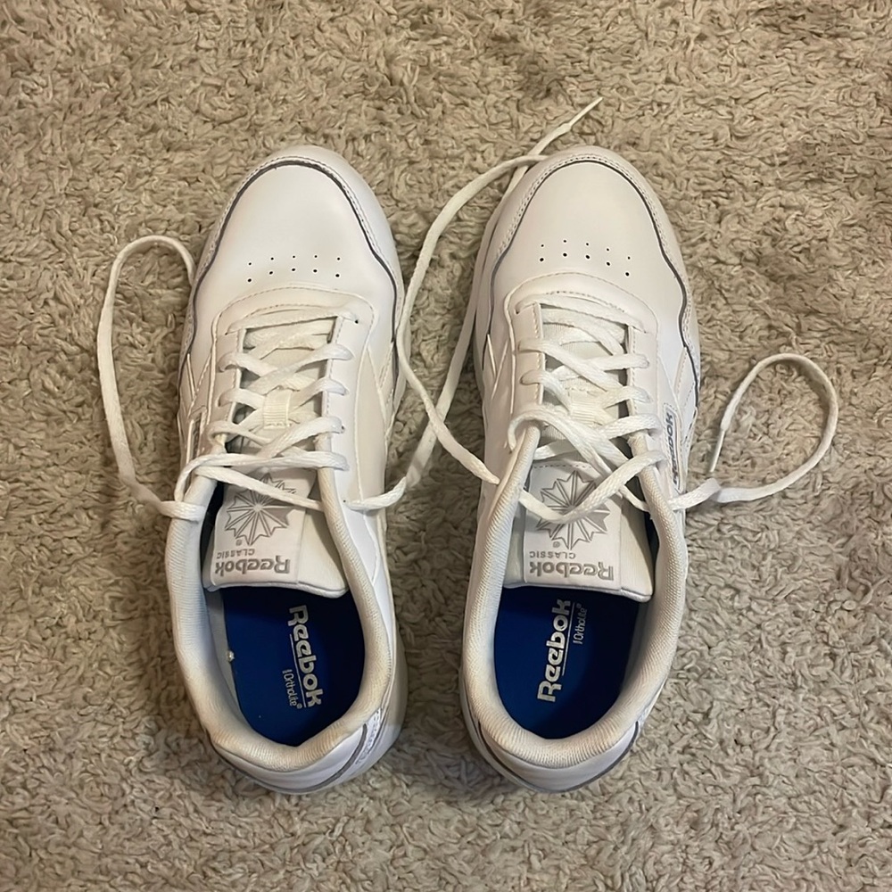 all white Reebok sneakers